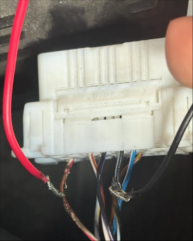 Other installer: exposed, unsealed wire splices on a vehicle connector