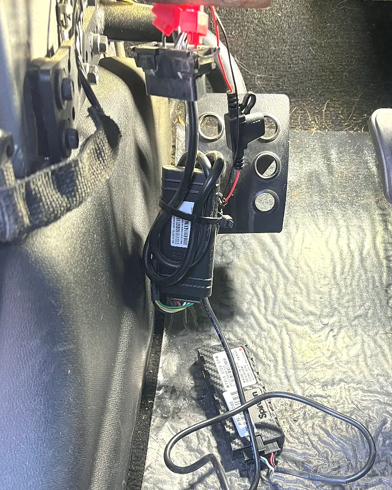 Other installer: a second GPS device piggybacked onto the old one and left hanging loose under the dash